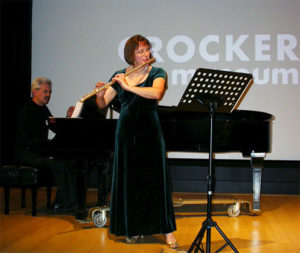 flutist performing at the Crocker Museum